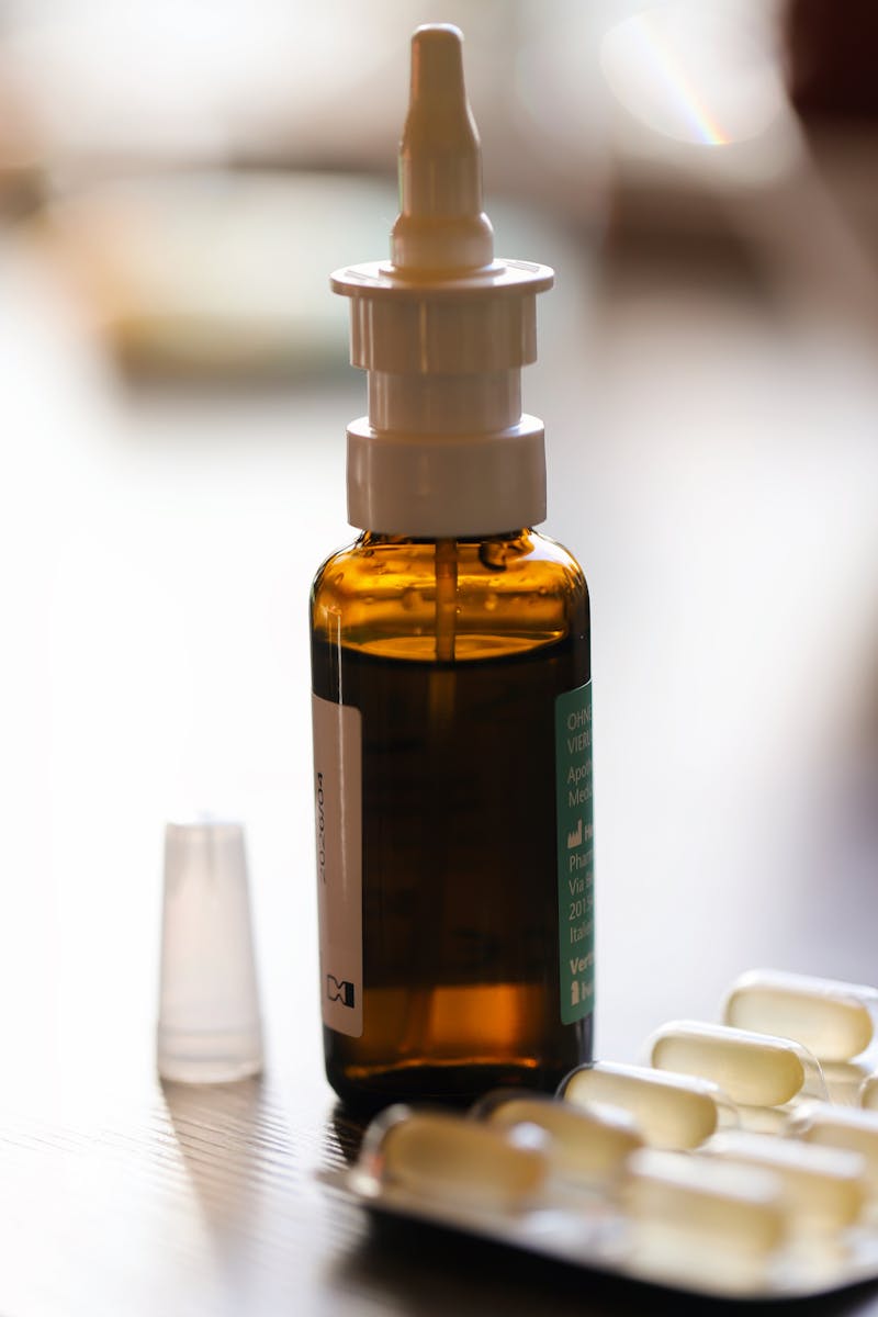 Nasal decongestant spray bottle with capsules — helps relieve ear congestion from colds