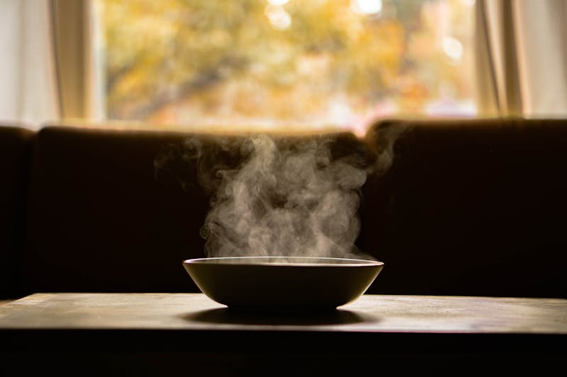 Steam rising from a hot bowl — steam inhalation helps loosen nasal congestion during a cold